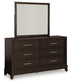 Neymorton King Upholstered Panel Bed with Mirrored Dresser